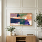 Abstract brushstroke art on a TV above a light oak sideboard with olive branches in a bright living room