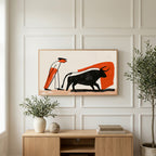 Matador and bull art on a TV above a light oak sideboard with olive branches in a bright living room