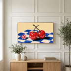 Cherry still life art on a TV above a light oak sideboard with olive branches in a bright living room