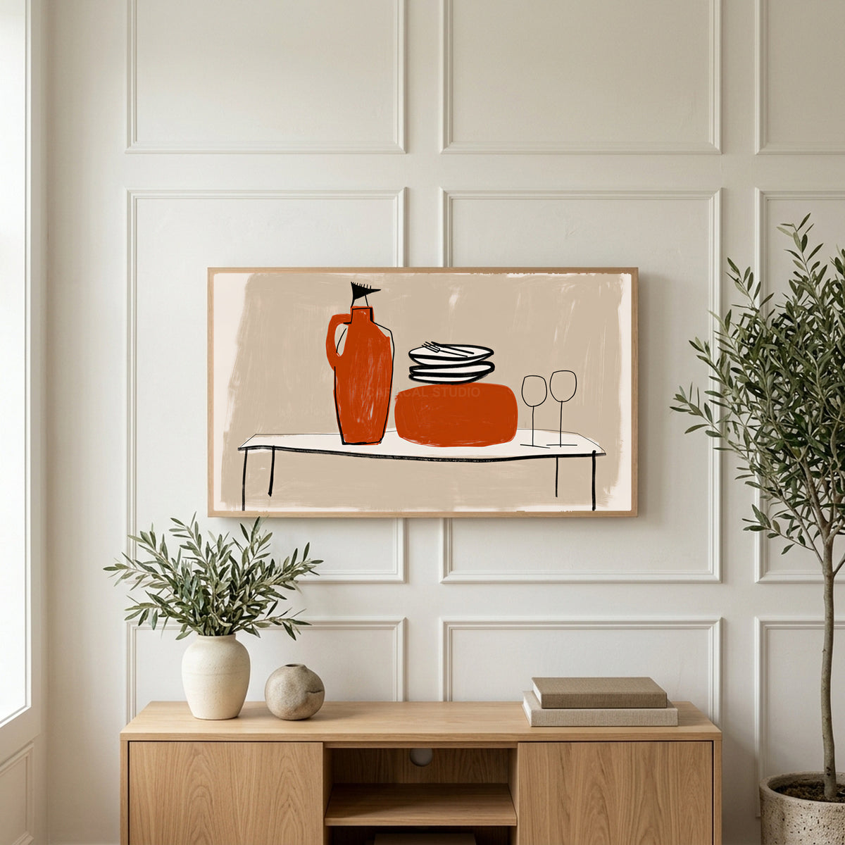 Minimalist table with jug and wine glasses art on a TV above a light oak sideboard with olive branches in a bright living room