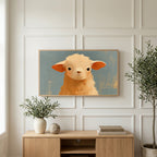 Grumpy lamb art on a TV above a light oak sideboard with olive branches in a bright living room
