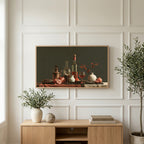 Wine and pomegranates still life art on a TV above a light oak sideboard with olive branches in a bright living room