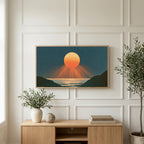 Ocean sunset art on a TV above a light oak sideboard with olive branches in a bright living room