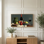 Wine and fruit still life art on a TV above a light oak sideboard with olive branches in a bright living room