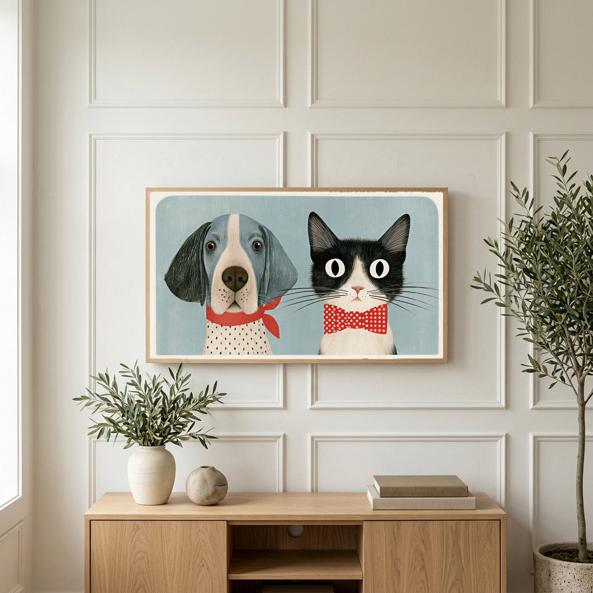 Dog and cat art on a TV above a light oak sideboard with olive branches in a bright living room