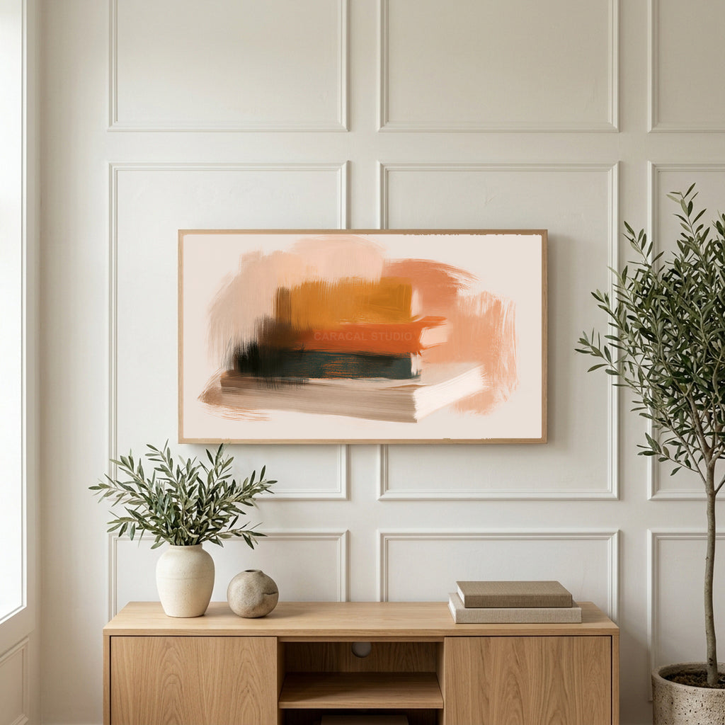 Book stack art on a TV above a light oak sideboard with olive branches in a bright living room
