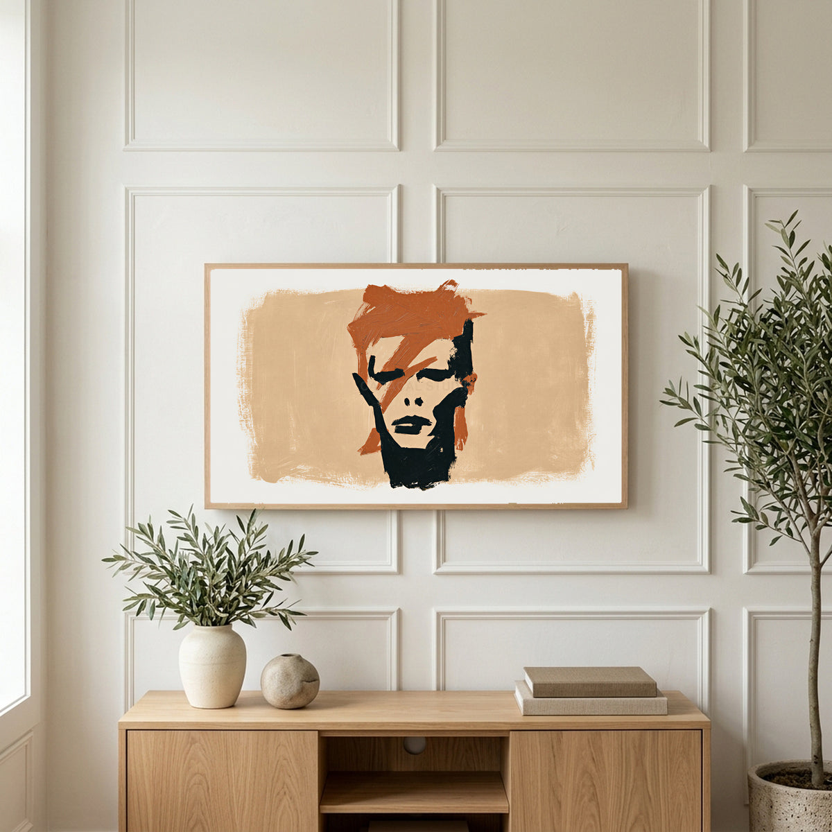 Lightning bolt portrait art on a TV above a light oak sideboard with olive branches in a bright living room