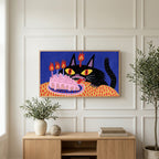 Birthday cat art on a TV above a light oak sideboard with olive branches in a bright living room