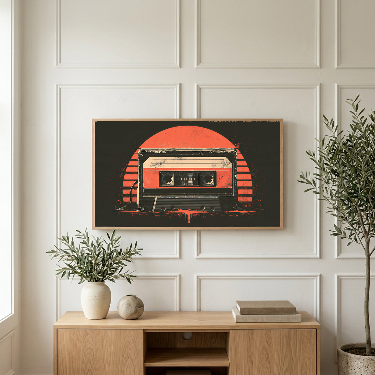 Retro cassette tape art on a TV above a light oak sideboard with olive branches in a bright living room