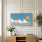 Sun and clouds art on a TV above a light oak sideboard with olive branches in a bright living room