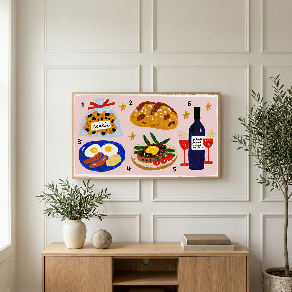 Food and wine doodles art on a TV above a light oak sideboard with olive branches in a bright living room