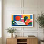 Colorful geometric mallard art on a TV above a light oak sideboard with olive branches in a bright living room
