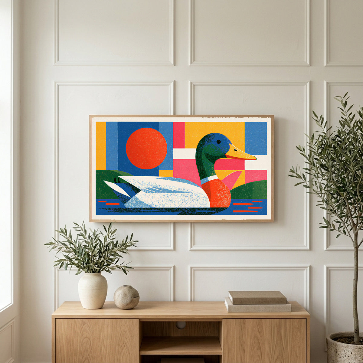 Colorful geometric mallard art on a TV above a light oak sideboard with olive branches in a bright living room