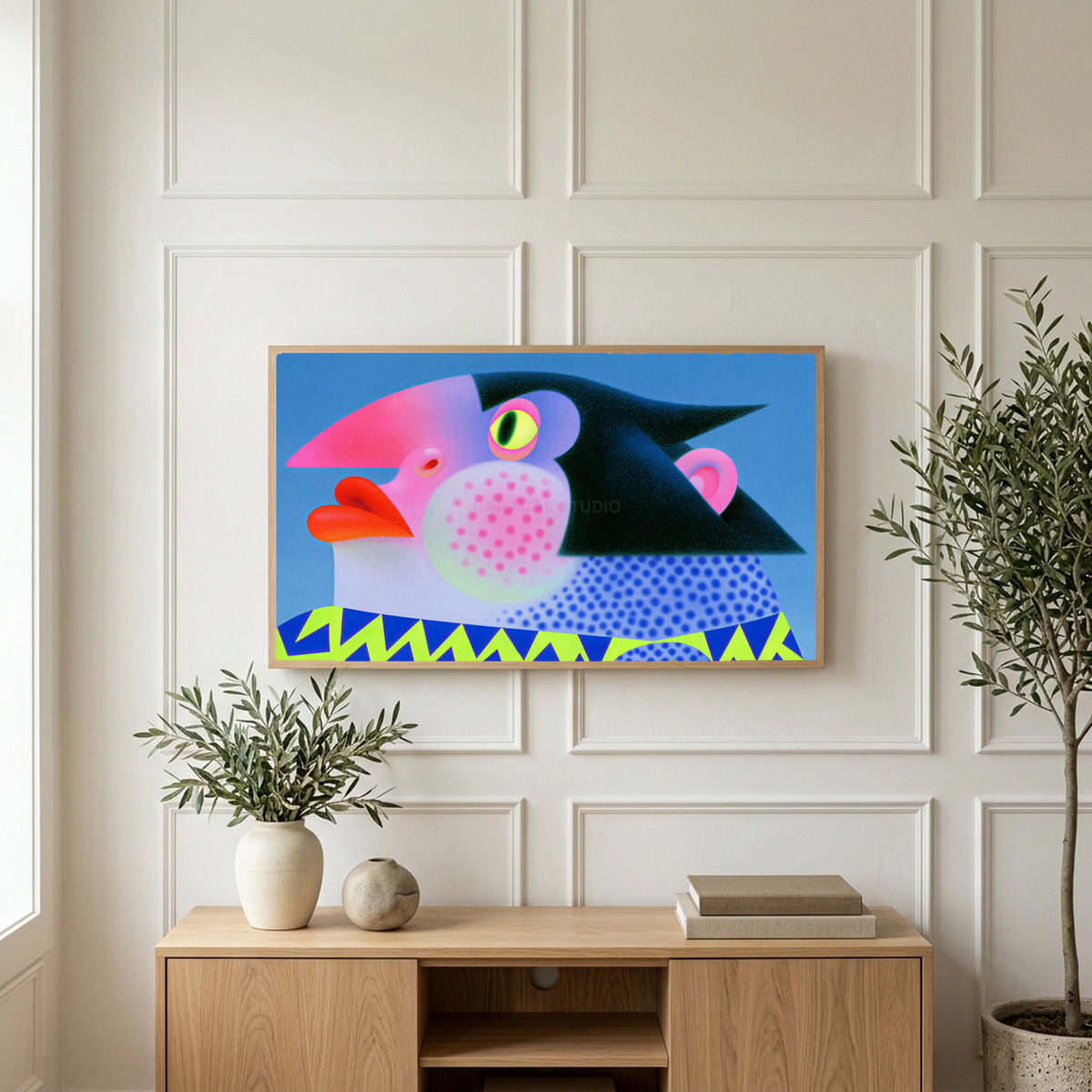 Pop art penguin art on a TV above a light oak sideboard with olive branches in a bright living room