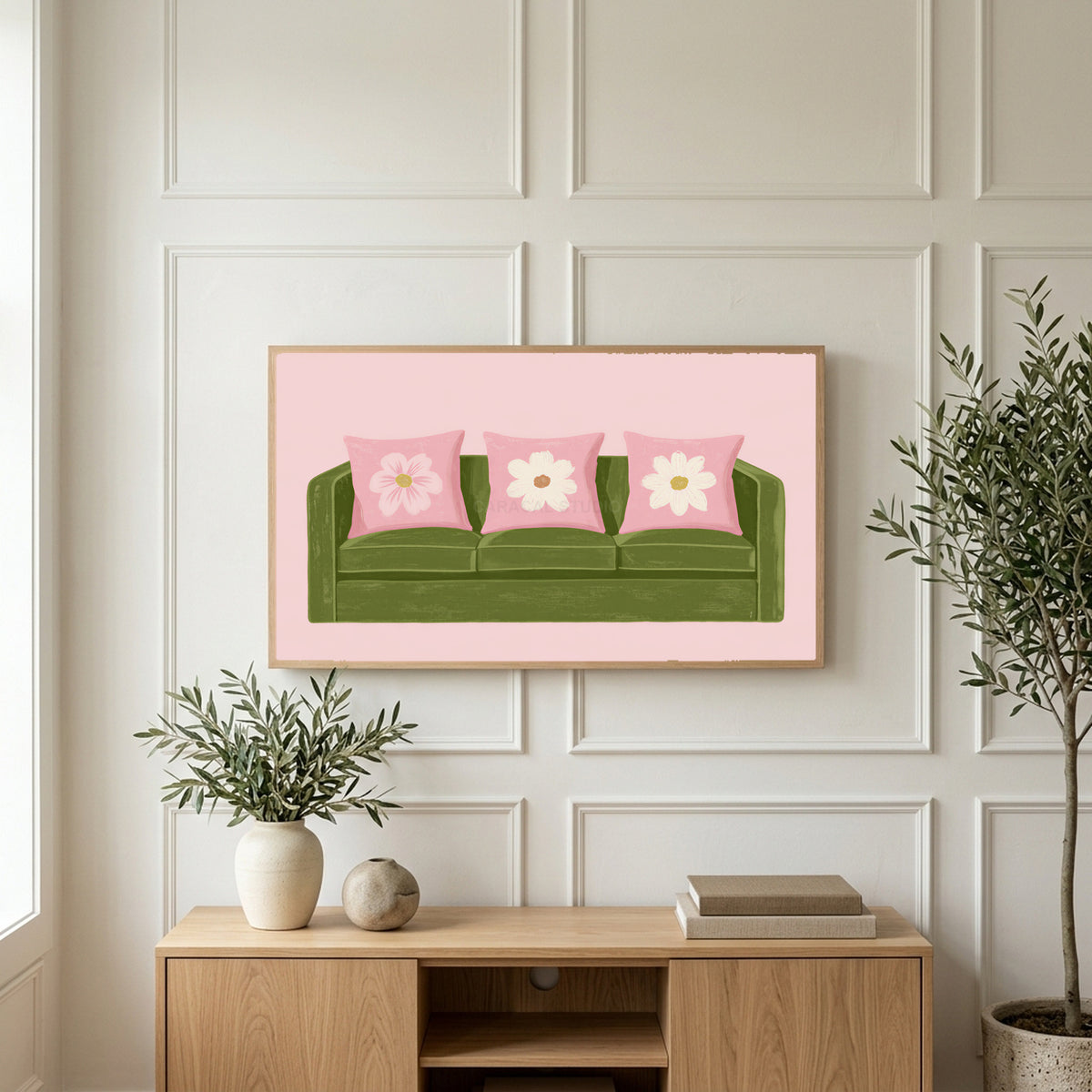 Green sofa art on a TV above a light oak sideboard with olive branches in a bright living room