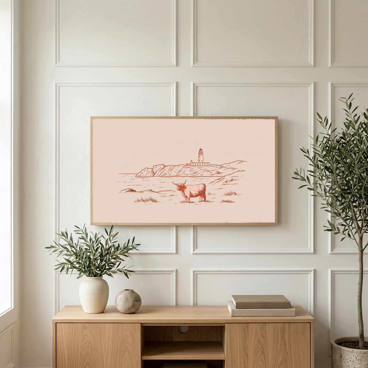Highland cow lighthouse art on a TV above a light oak sideboard with olive branches in a bright living room