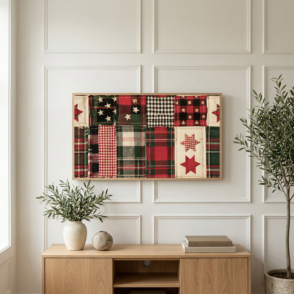 Plaid patchwork quilt art on a TV above a light oak sideboard with olive branches in a bright living room