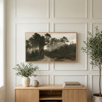 Misty pine forest path art on a TV above a light oak sideboard with olive branches in a bright living room