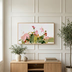 Abstract wildflowers art on a TV above a light oak sideboard with olive branches in a bright living room