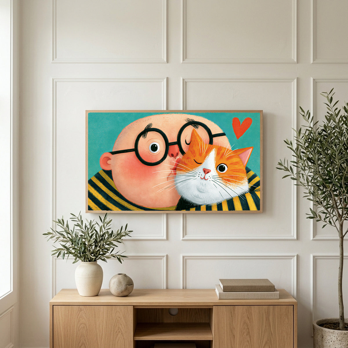 Man with his ginger cat art on a TV above a light oak sideboard with olive branches in a bright living room