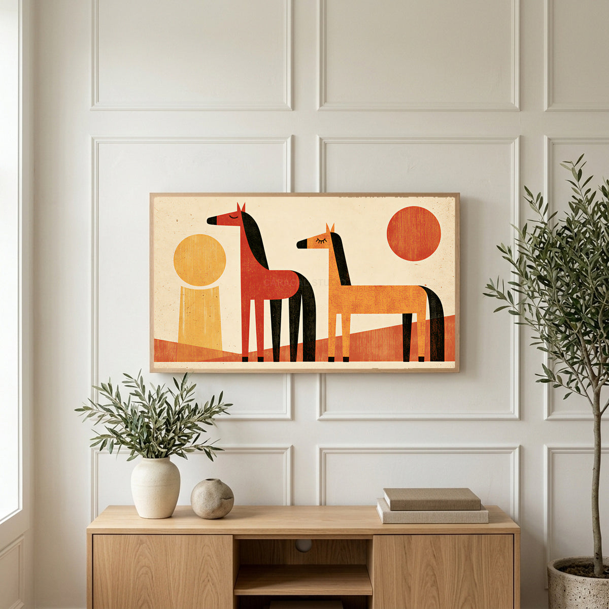 Retro horses art on a TV above a light oak sideboard with olive branches in a bright living room