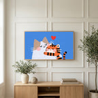 Two cats with a heart art on a TV above a light oak sideboard with olive branches in a bright living room