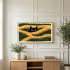 Black cat in grass art on a TV above a light oak sideboard with olive branches in a bright living room