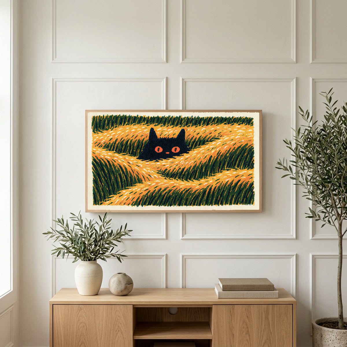 Black cat in grass art on a TV above a light oak sideboard with olive branches in a bright living room