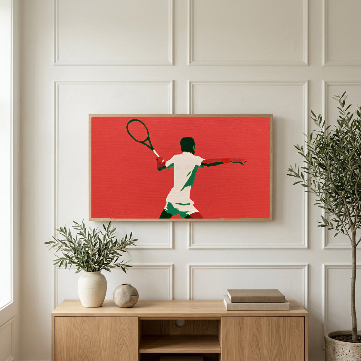 Tennis player art on a TV above a light oak sideboard with olive branches in a bright living room