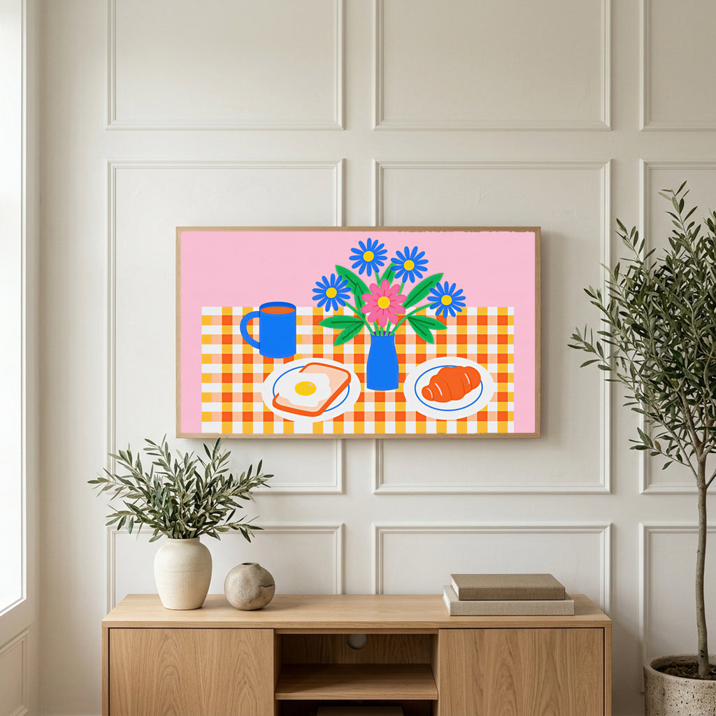 Breakfast table with flowers art on a TV above a light oak sideboard with olive branches in a bright living room