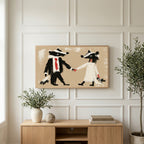 Badger bride and groom art on a TV above a light oak sideboard with olive branches in a bright living room