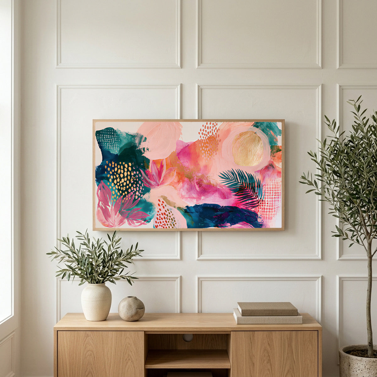 Tropical abstract art on a TV above a light oak sideboard with olive branches in a bright living room