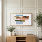 Eye collage art on a TV above a light oak sideboard with olive branches in a bright living room