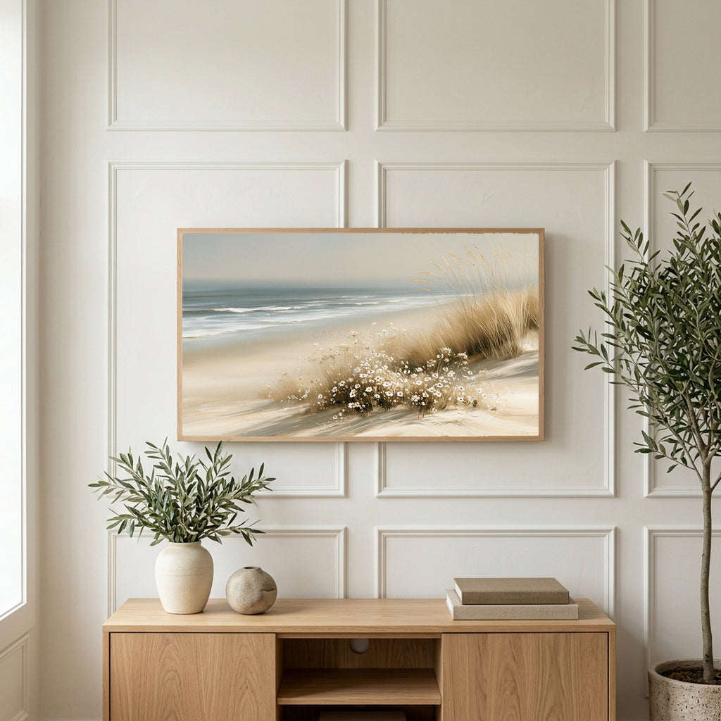 Dune grass and daisies art on a TV above a light oak sideboard with olive branches in a bright living room