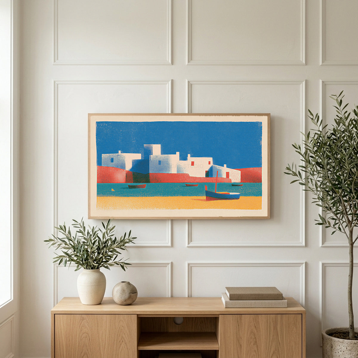 Mediterranean village art on a TV above a light oak sideboard with olive branches in a bright living room
