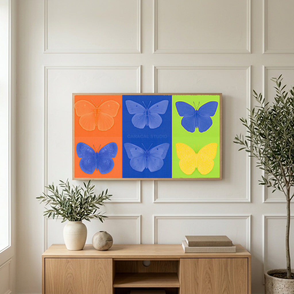 Pop art butterfly art on a TV above a light oak sideboard with olive branches in a bright living room