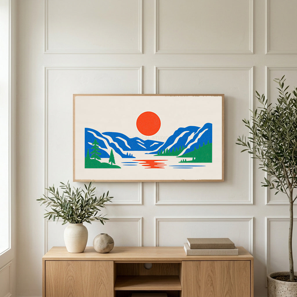 Mountain lake sun art on a TV above a light oak sideboard with olive branches in a bright living room