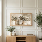 Neutral succulent pots art on a TV above a light oak sideboard with olive branches in a bright living room