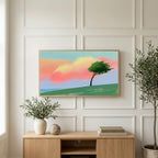 Tree on a hill at sunset art on a TV above a light oak sideboard with olive branches in a bright living room