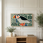 Folk art puffin art on a TV above a light oak sideboard with olive branches in a bright living room
