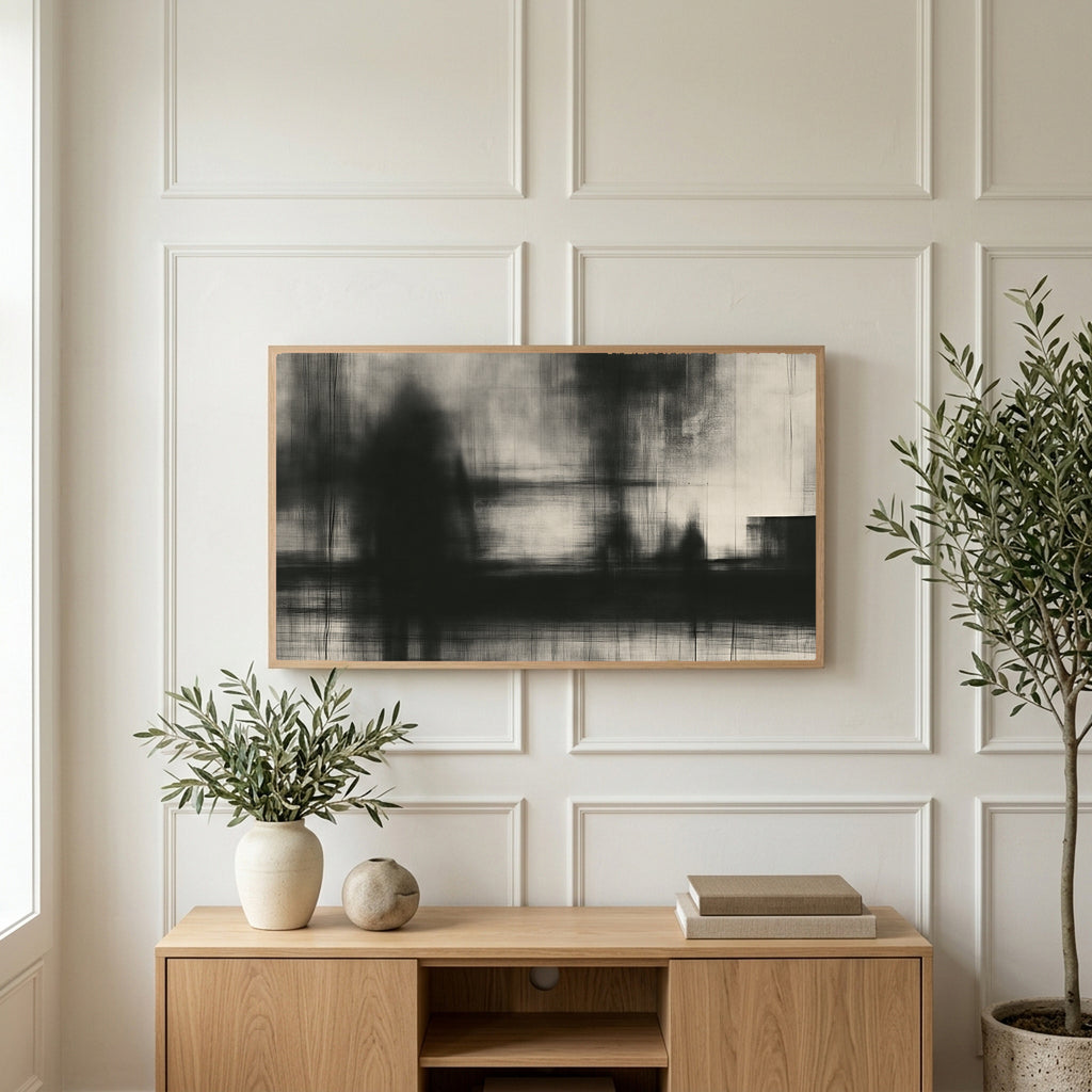 Black and white abstract art on a TV above a light oak sideboard with olive branches in a bright living room