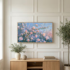 Pink spring flower buds art on a TV above a light oak sideboard with olive branches in a bright living room