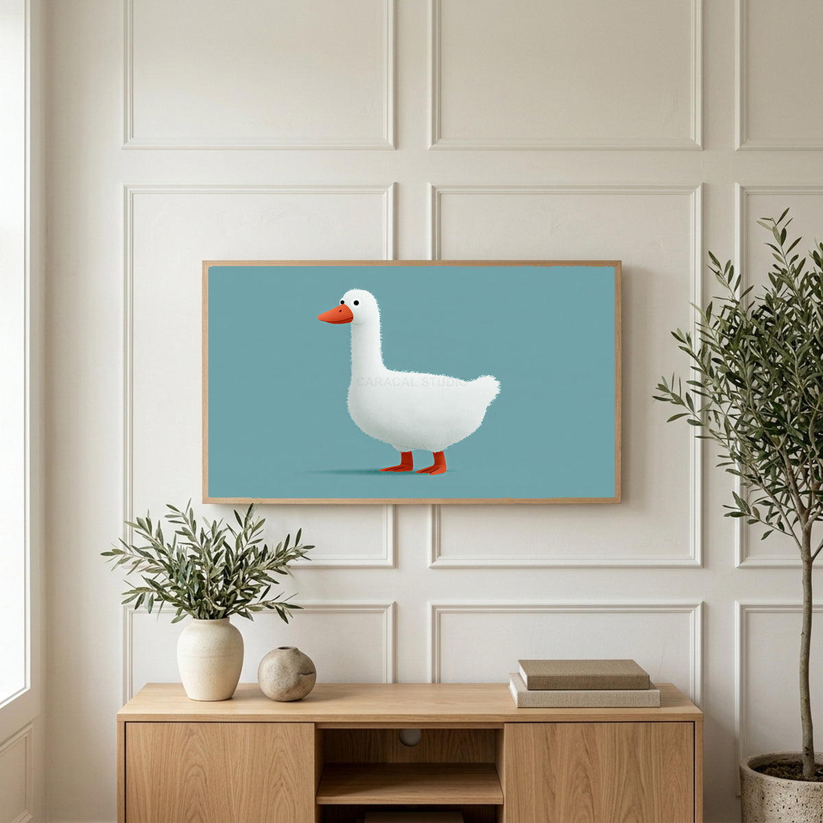 White duck art on a TV above a light oak sideboard with olive branches in a bright living room
