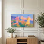 Blurred meadow runners art on a TV above a light oak sideboard with olive branches in a bright living room