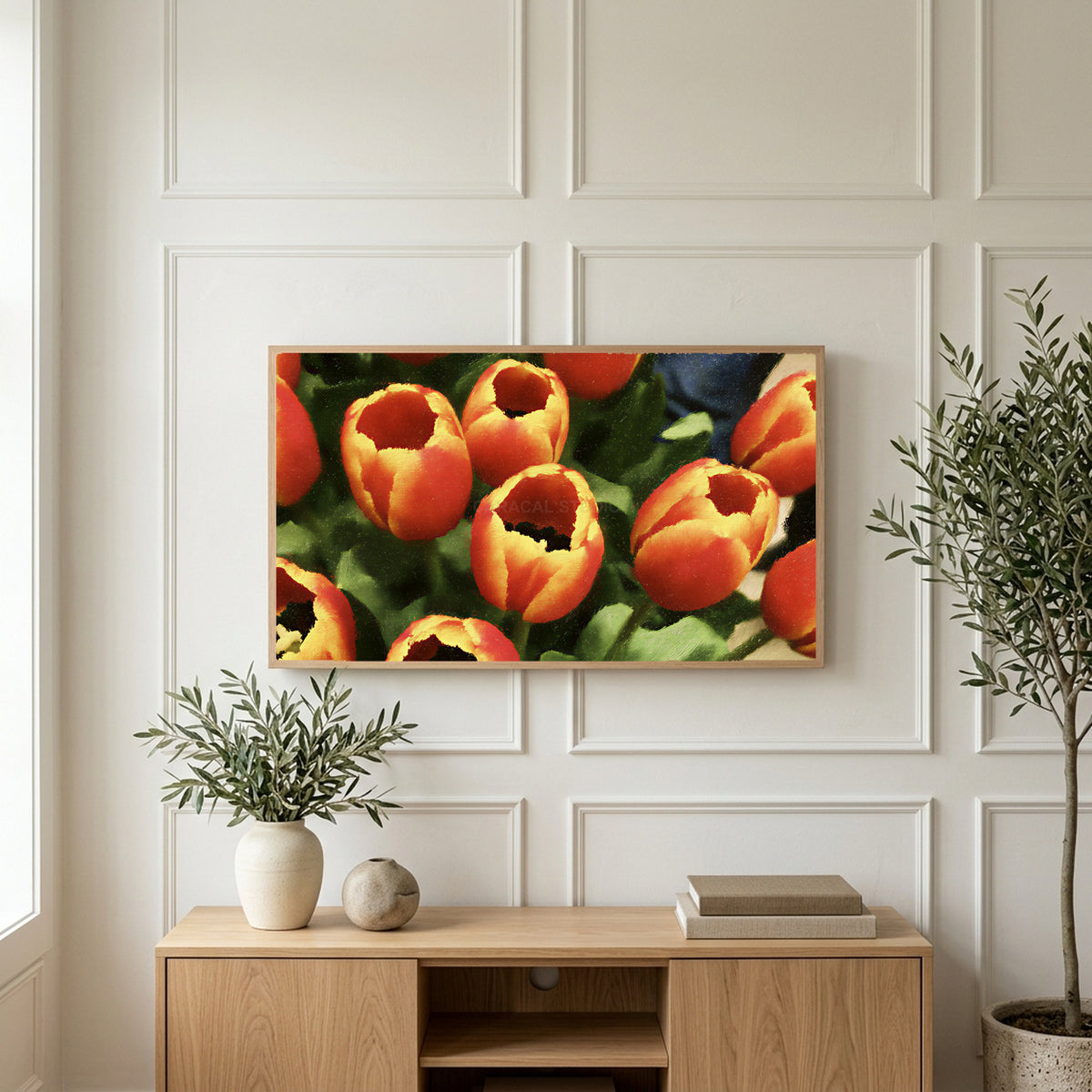 Orange tulip bouquet art on a TV above a light oak sideboard with olive branches in a bright living room