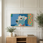 Terrier portrait art on a TV above a light oak sideboard with olive branches in a bright living room