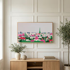 Paris skyline art on a TV above a light oak sideboard with olive branches in a bright living room