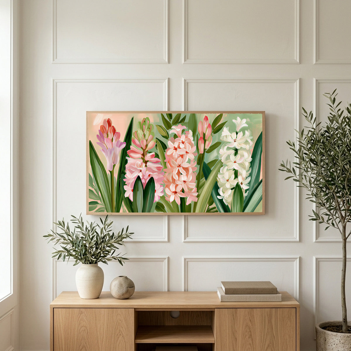 Spring hyacinths art on a TV above a light oak sideboard with olive branches in a bright living room