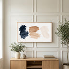Paint stroke art on a TV above a light oak sideboard with olive branches in a bright living room