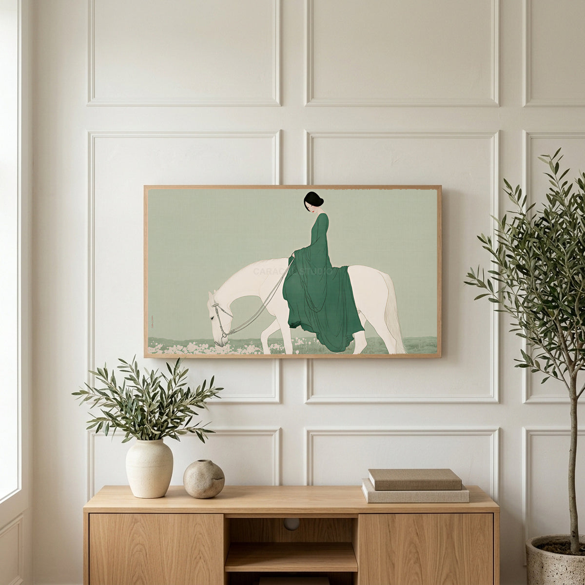 Woman riding a horse art on a TV above a light oak sideboard with olive branches in a bright living room